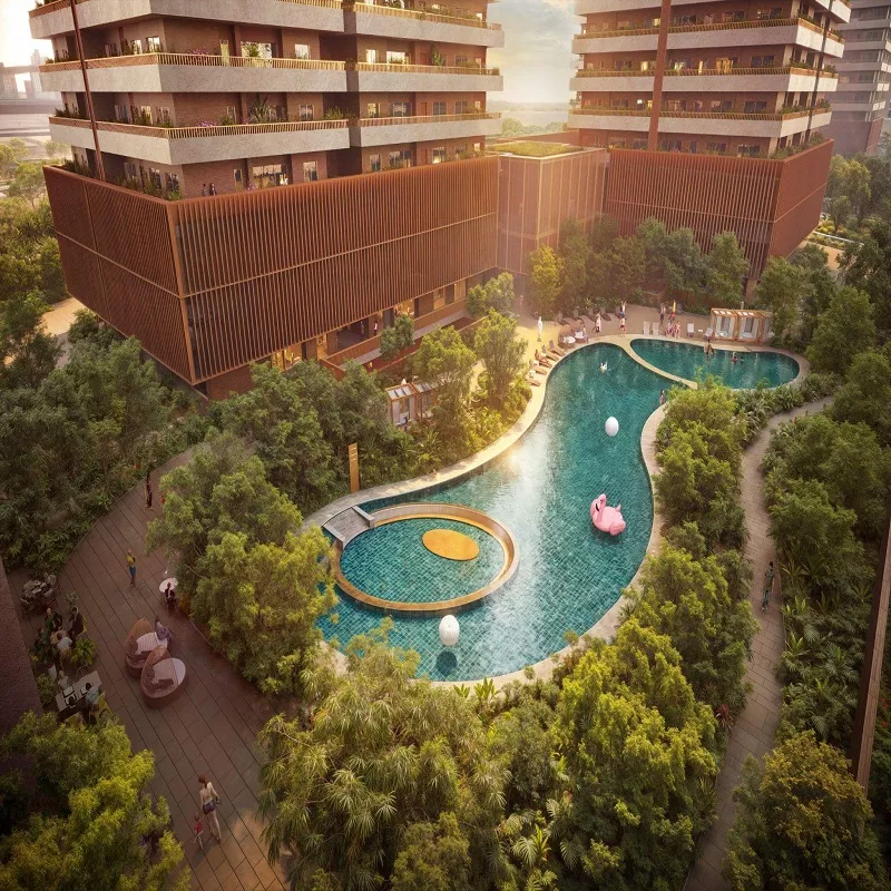 MAX Estates 360 luxury swimming pool surrounded by landscaped gardens and modern residential towers